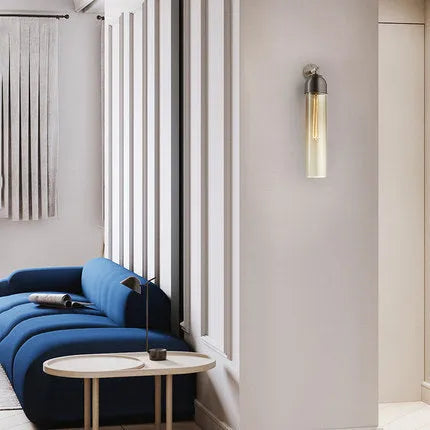 Modern minimalist glass wall lamp with an E27 holder in a choice of light colours on a living room wall.