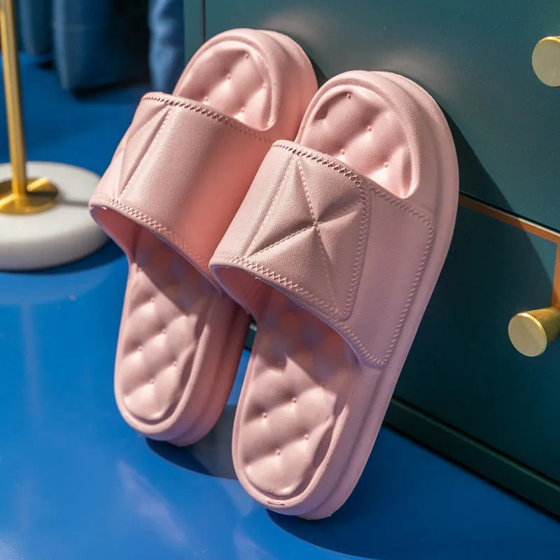 A pair of soft EVA bathroom slippers with a thick non-slip sole, shown in a choice of colours.