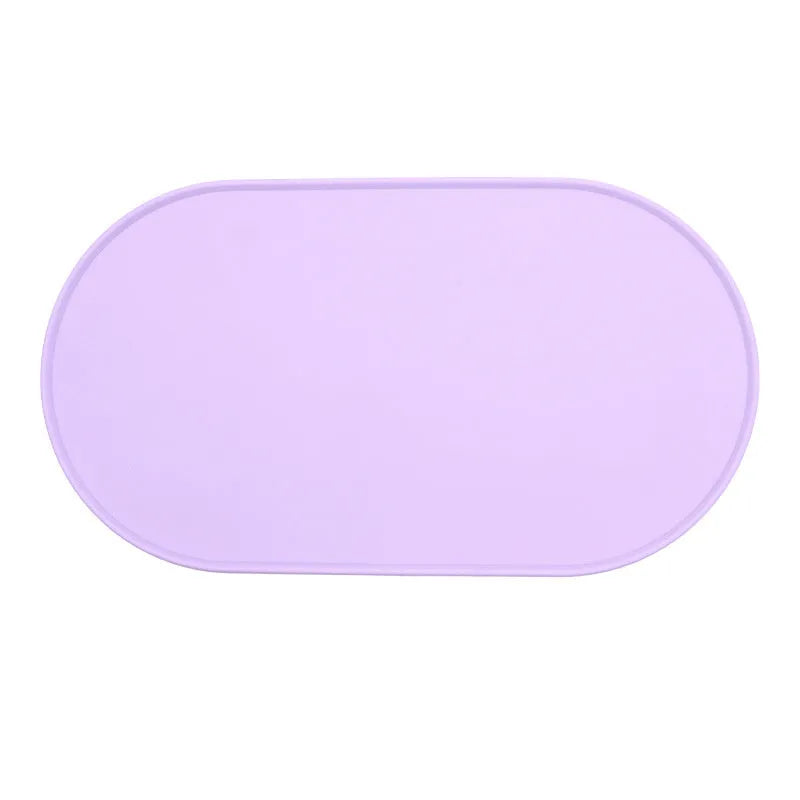 Green silicone waterproof cat feeding placemat with non-slip backing under a food bowl