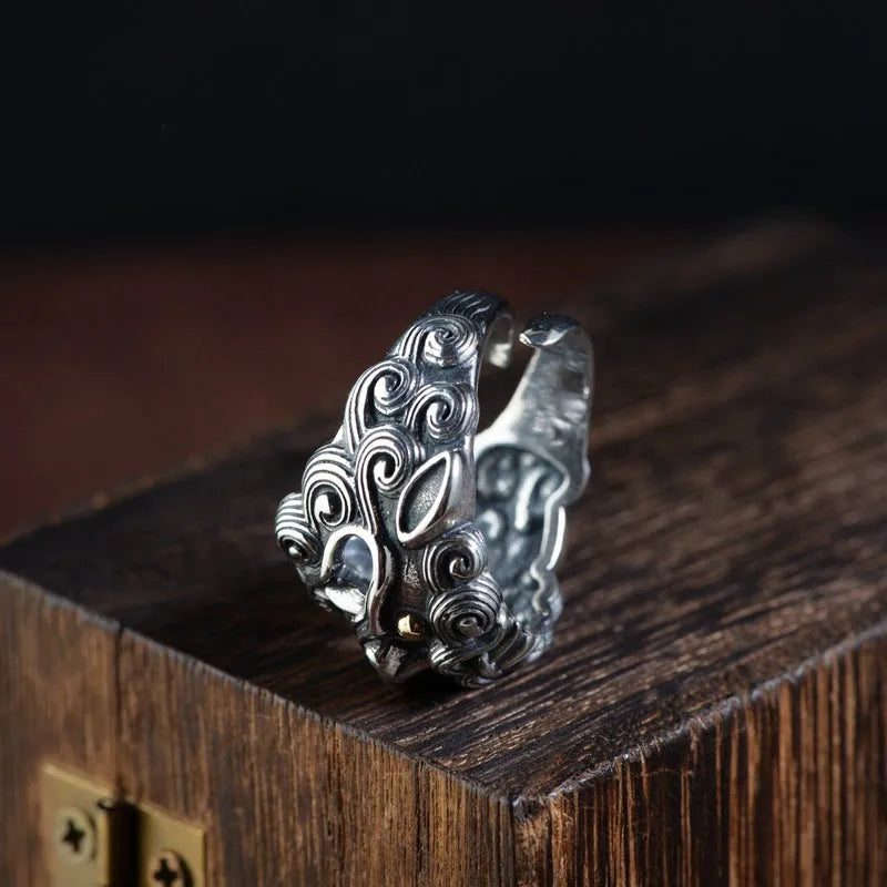 Silver open ring with detailed animal and zodiac modelling in jibeast pattern, retro style