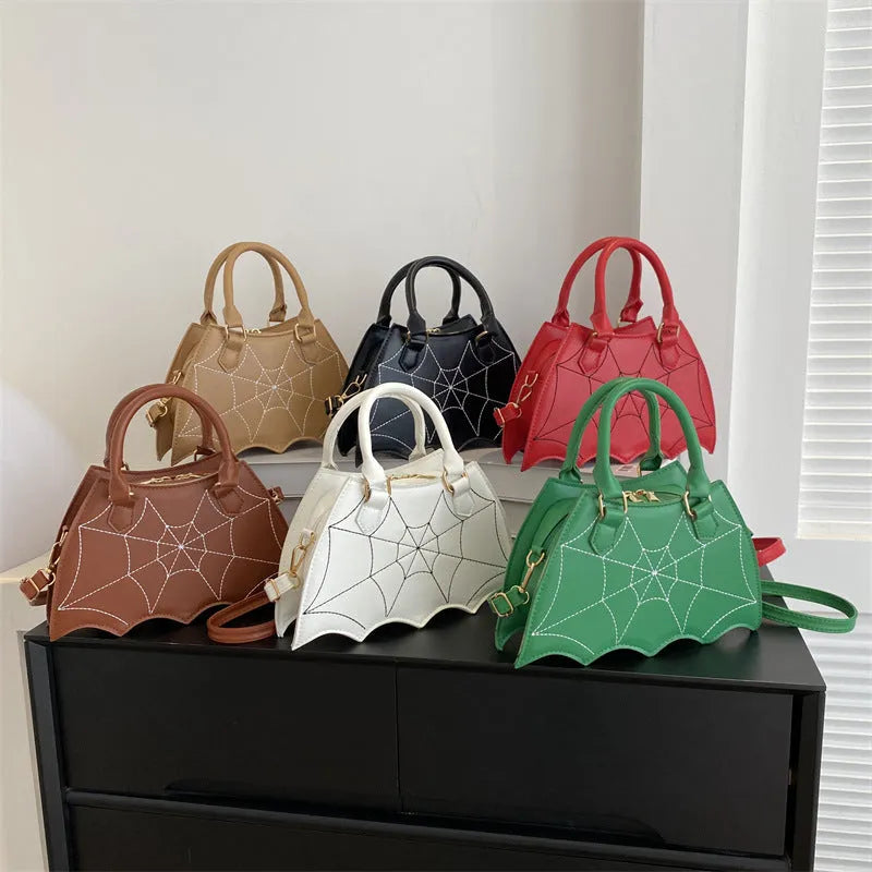 Women's small square PU saddle bag with spider web pattern, crossbody strap, and top handle, available in six colours including black and red