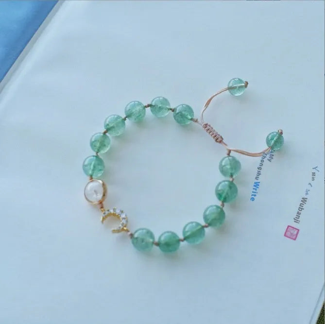 Handcrafted strawberry quartz crystal bracelet with Hetian jade peach blossom charms for women