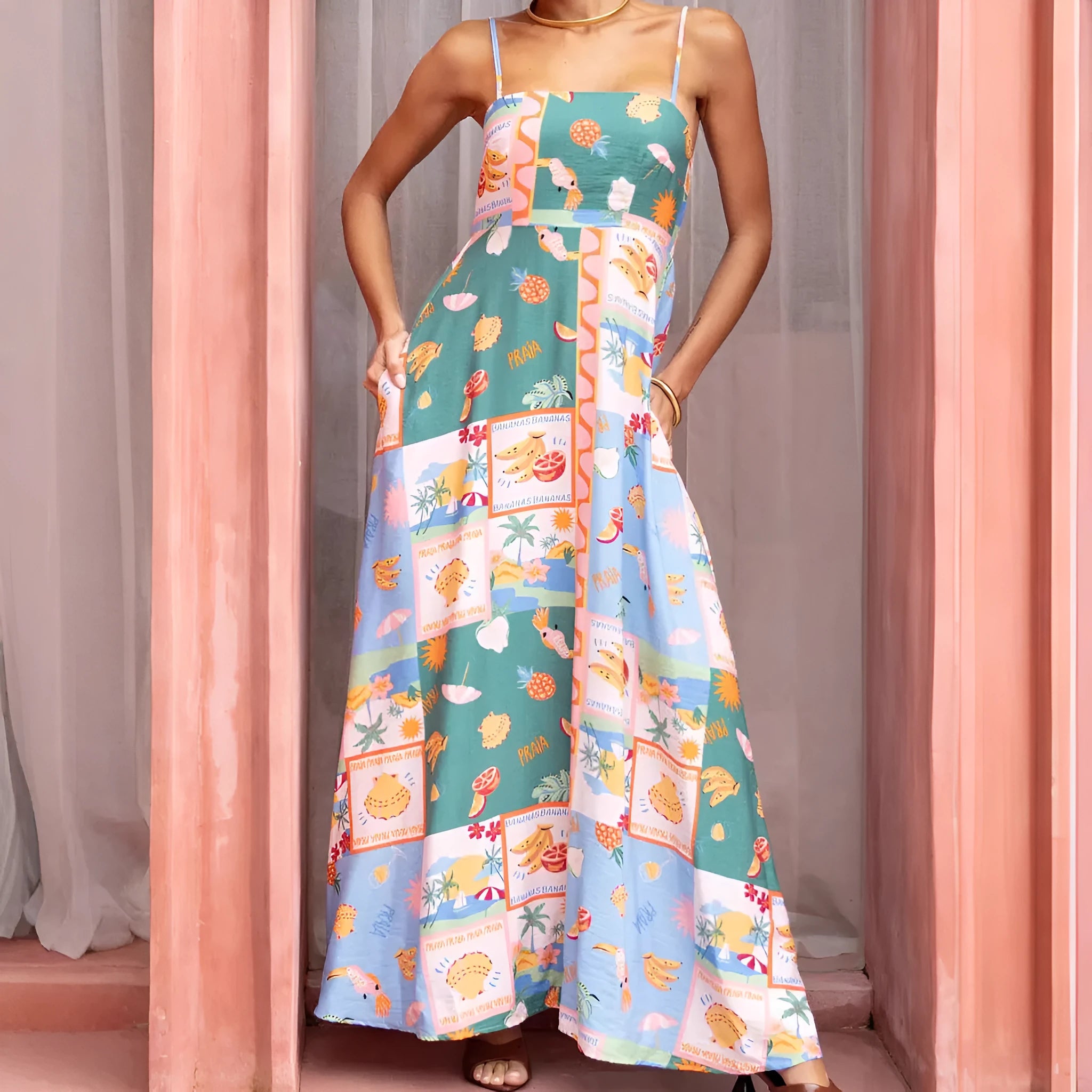 Women's green printed sleeveless flared strap long dress with pockets, polyester fabric