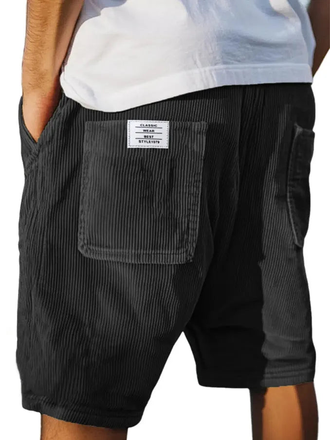 Men's grey straight-leg corduroy shorts with multiple pockets and embroidery detail on a hanger.