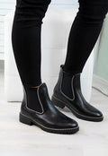 Women's short Martin boots in black PU sheep pattern with round toe and rubber sole