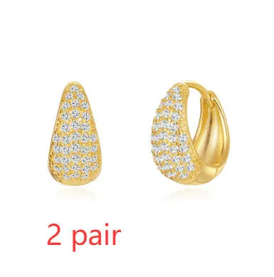 Golden brass diamond earclip earrings with geometric round design and butterfly backings