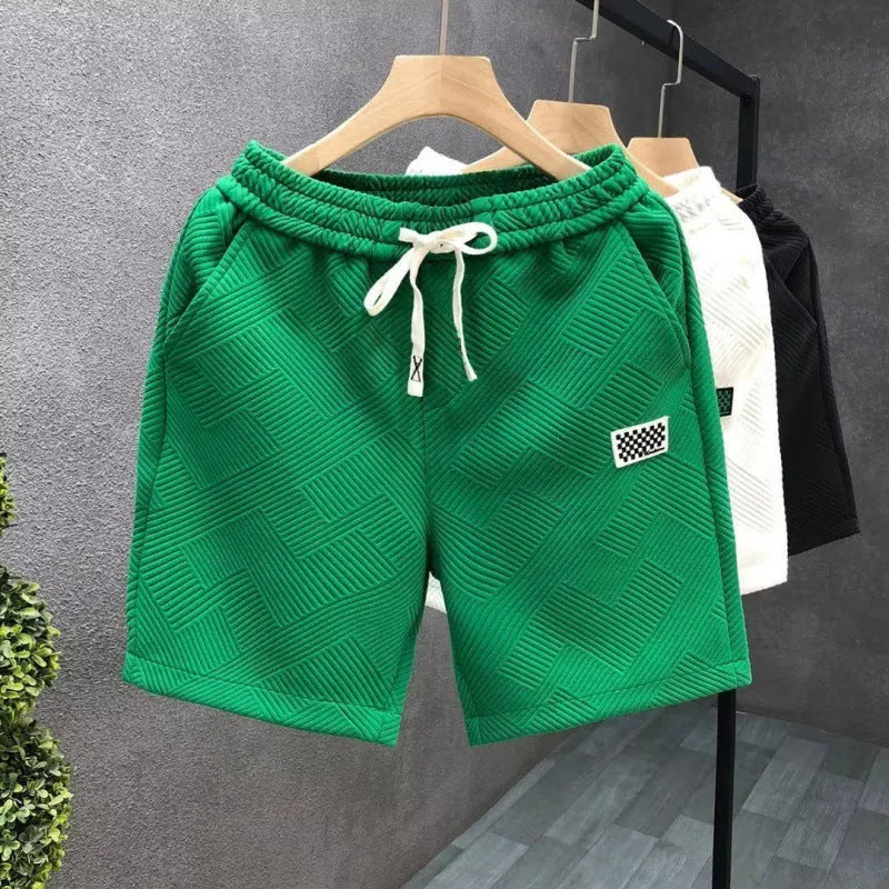 Casual polyester sports shorts with micro elasticity in black, white or green colours