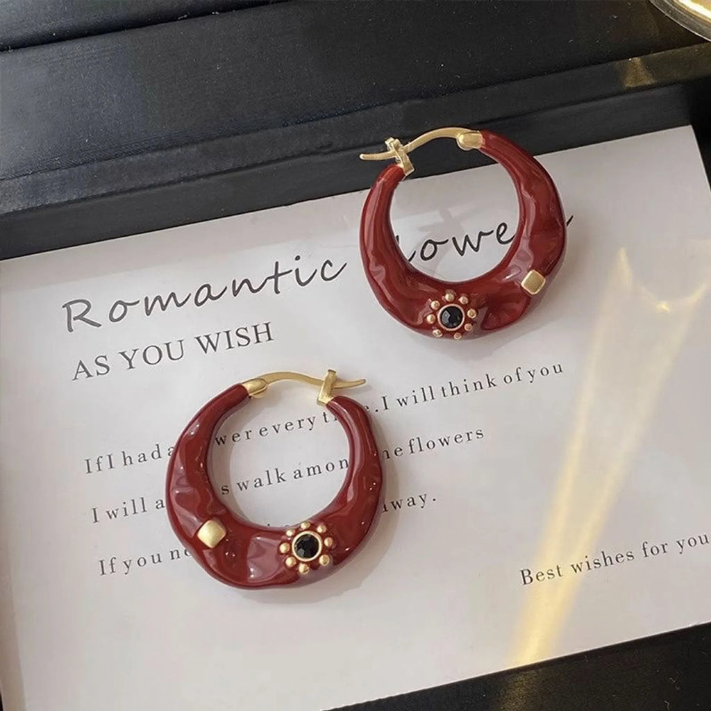 Hong Kong style retro ear studs with dripping oil finish and rhinestone inlay in black and red colours