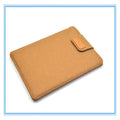 Khaki clamshell laptop bag open to show plush interior and corner protectors for tablet and notebook