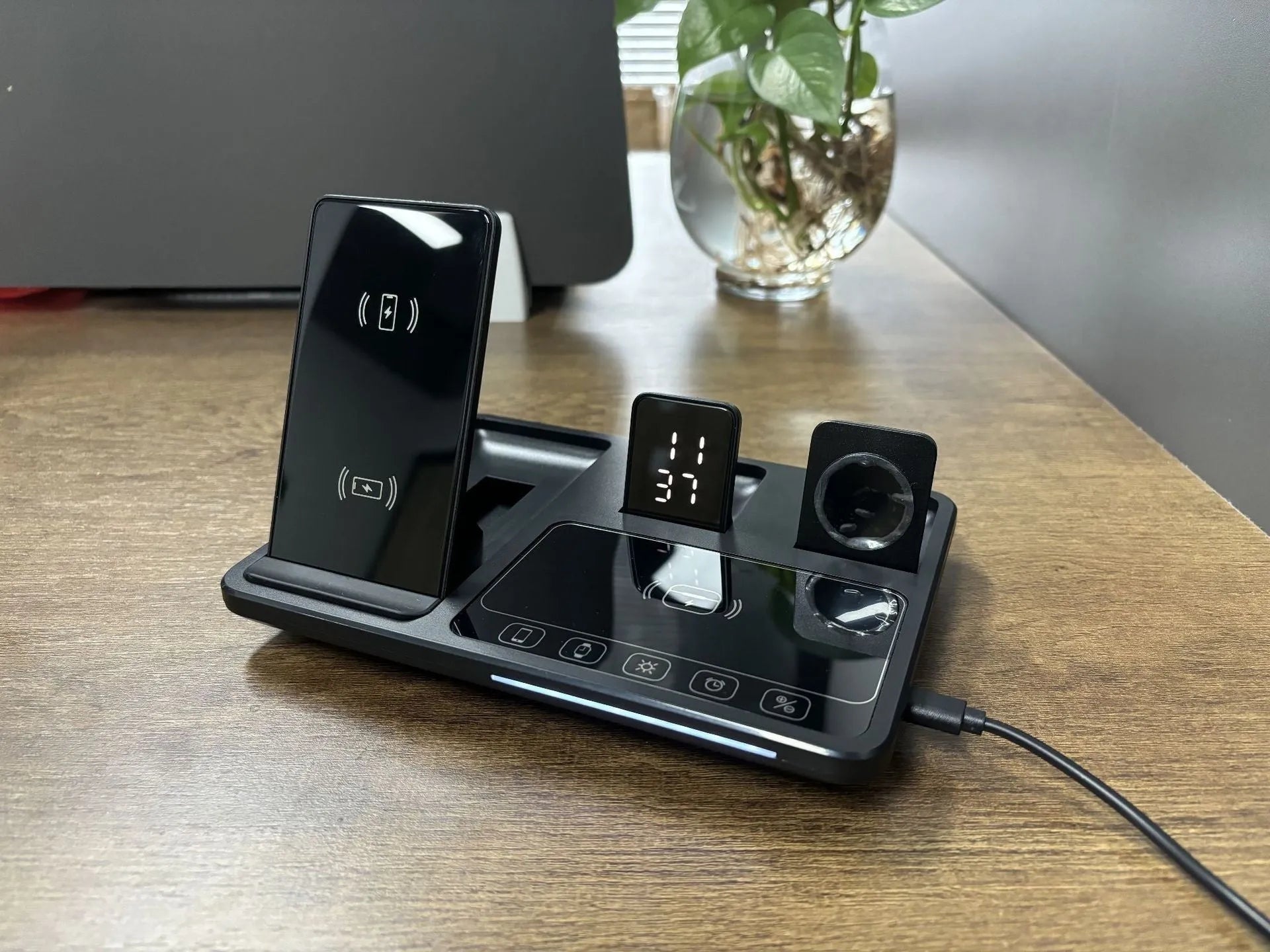 Multifunctional wireless fast charging clock with folding bracket, black plastic version, charging a phone upright
