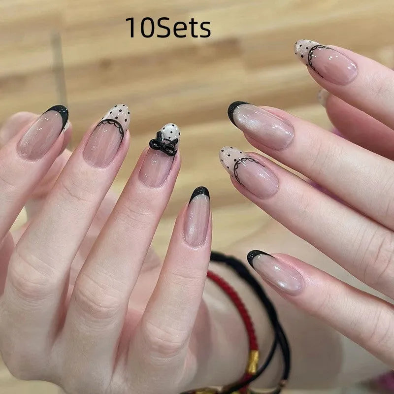 Set of sweet girl themed false nail tips with various designs for short to medium natural nails.