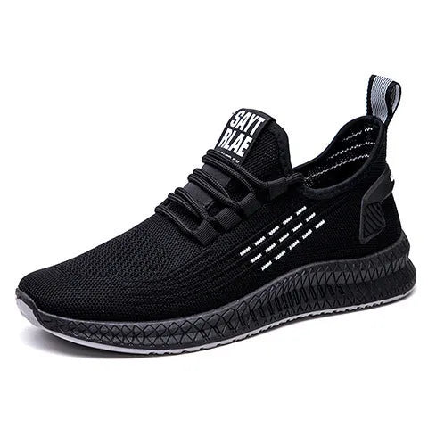 Men's low-top casual trainers with Flying Weave upper, cross straps, and striped pattern in black, orange, or yellow.