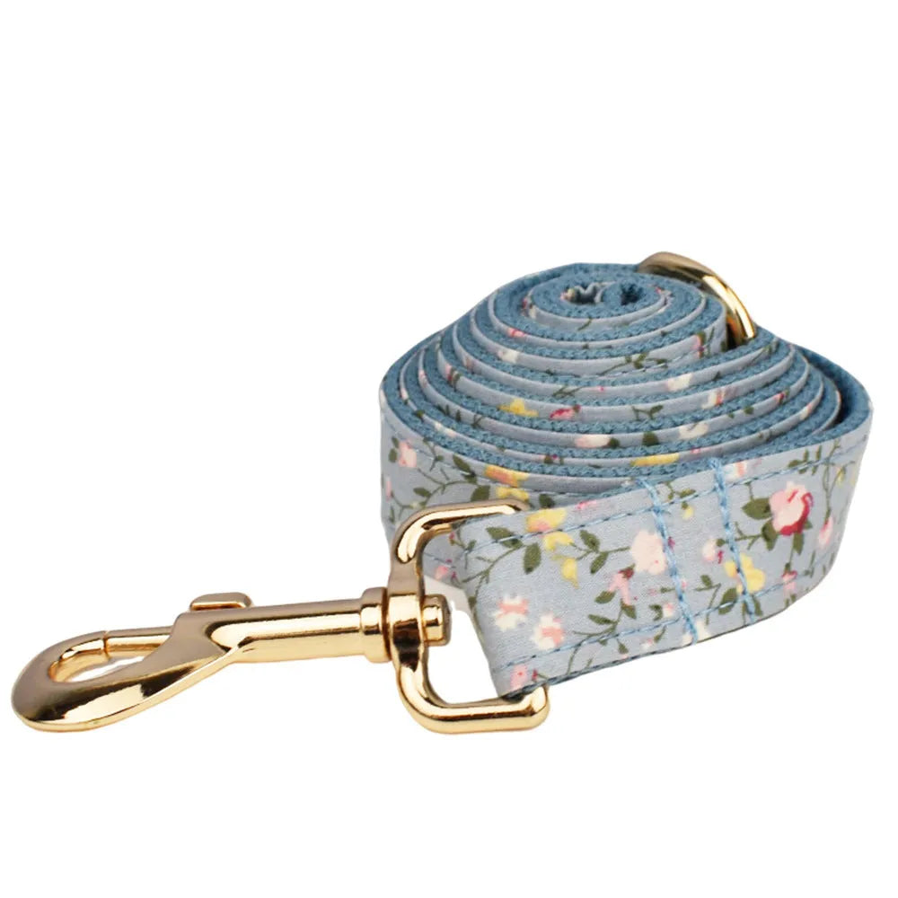 Floral pattern dog collar set with leash, vest, bow, and poop bag holder in five coordinated pieces