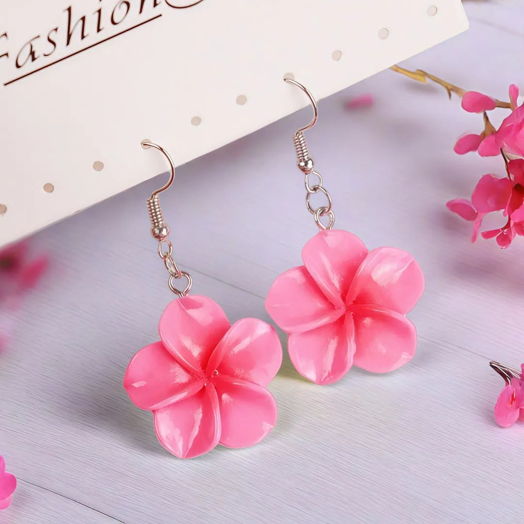 Handmade plastic resin earrings shaped like plumeria rubra flowers in a pair with multiple colour options