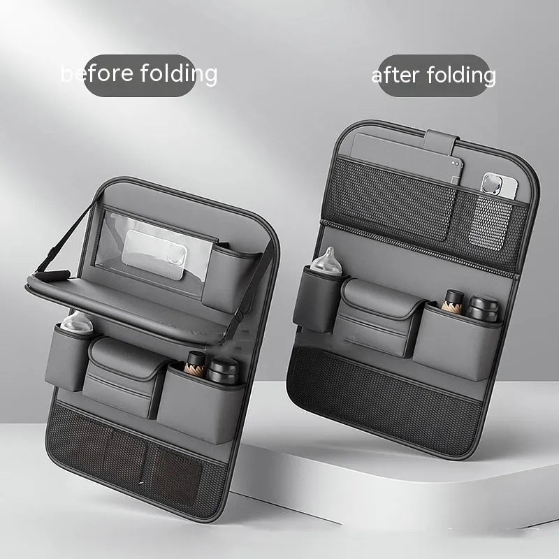 Car seat lazyback storage bag in Obsidian Black with foldable dining table extended, hanging on a car front seat backrest