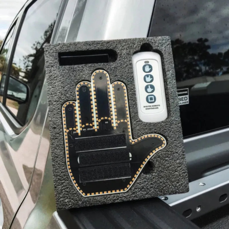 Black plastic car gesture light with LED illuminated hand gesture, remote control, and 3M Velcro mounting