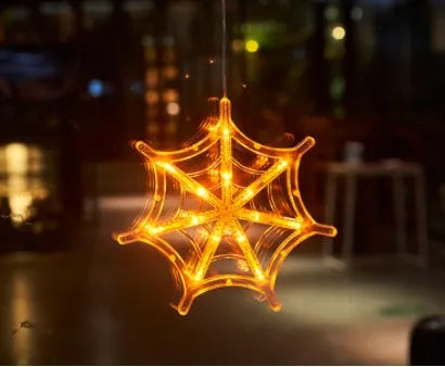 Seven Halloween LED window lights with spider, pumpkin and ghost designs on suction cups