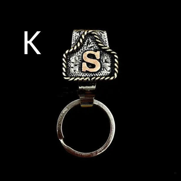 Handmade metal keychain with a cow tag charm in one of 26 available colour options.