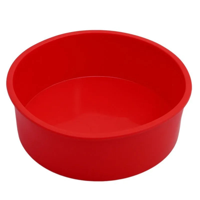 Red round silicone cake mould on a baking tray showing 8 inch size with smooth interior