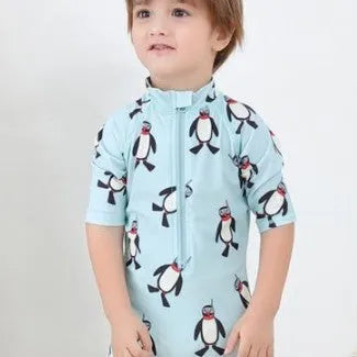 Boys' penguin print long sleeve one-piece swimsuit with matching swimming cap