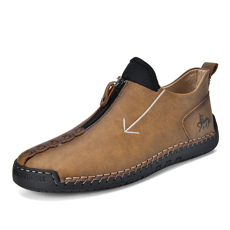 Men's black leather zip-up boots with round toe and hand-stitched rubber sole on a white background.