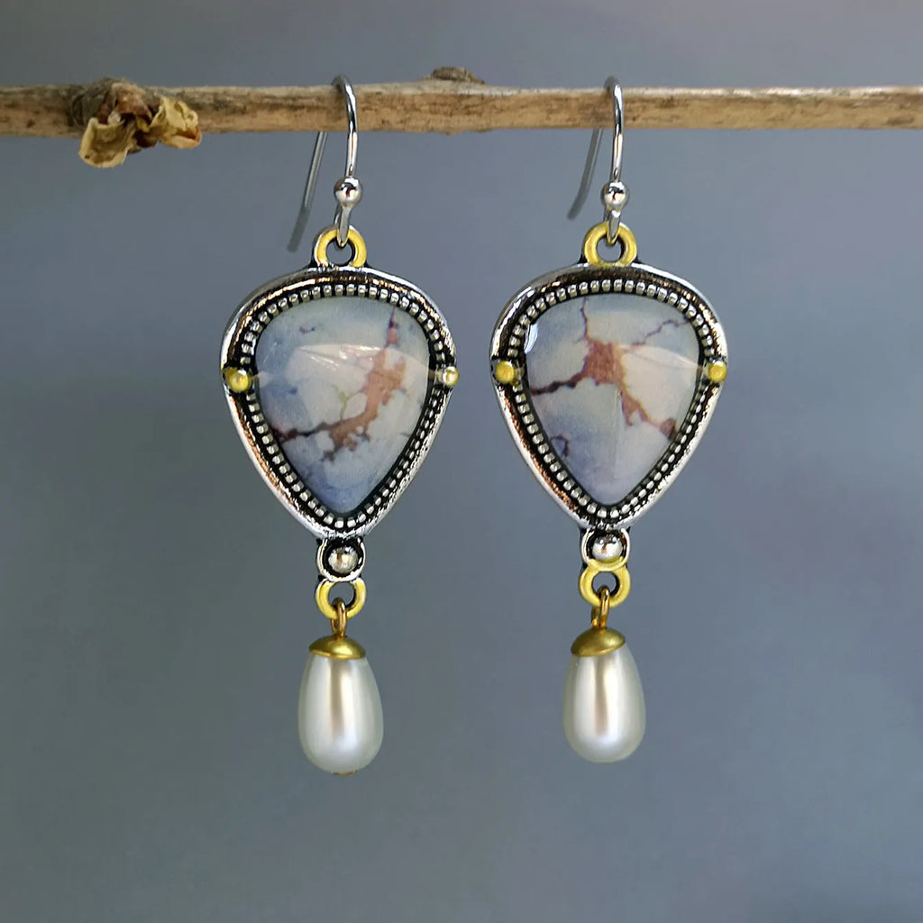 Retro blue drop earrings with geometric design featuring synthetic opal and pearl elements on electroplated metal