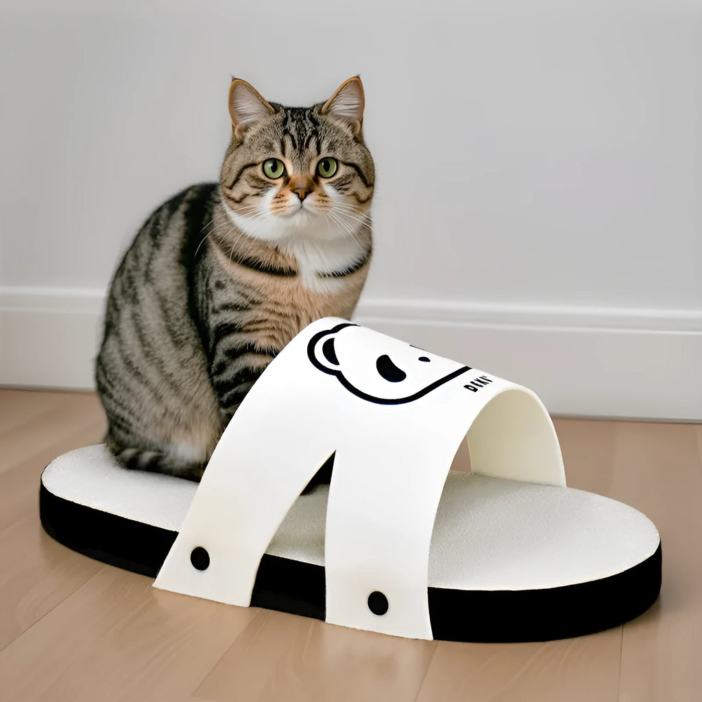 White corrugated paper cat scratch board in slipper style design on flat surface