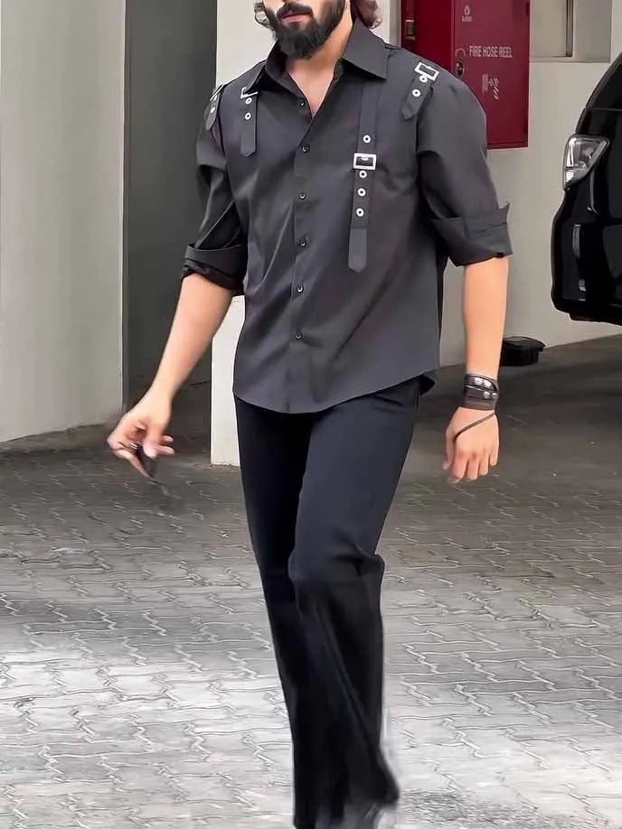 Man wearing a black regular-fit polyester button-up shirt for casual daily wear.