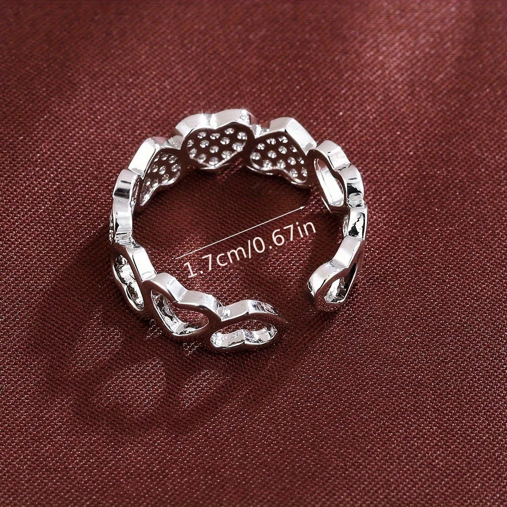 Geometric adjustable opening couples ring with heart design in gold or silver colour.