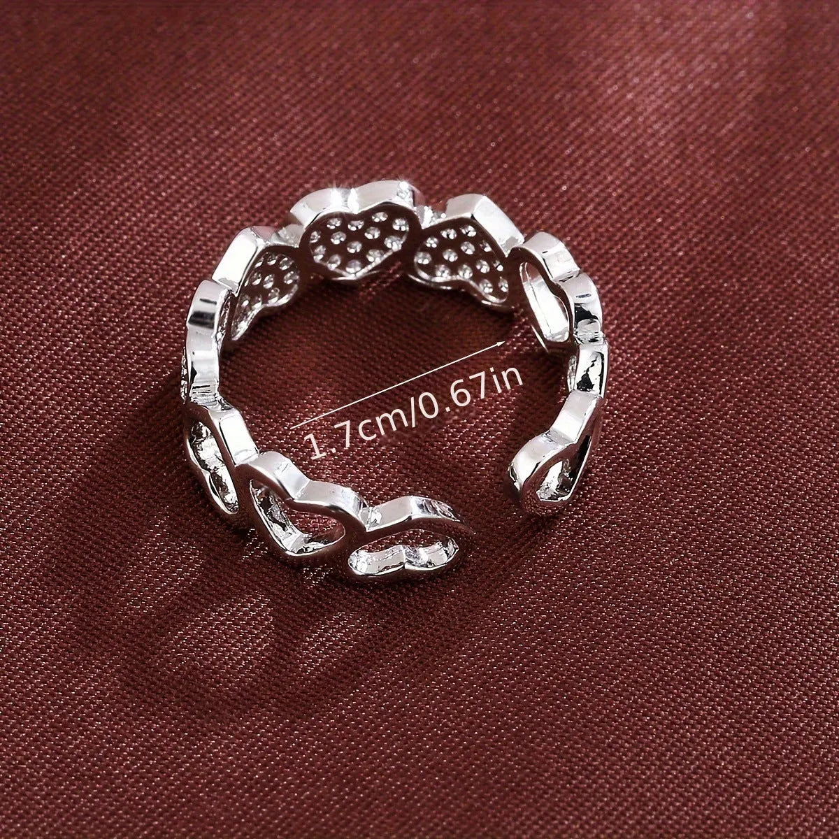Geometric adjustable opening couples ring with heart design in gold or silver colour.