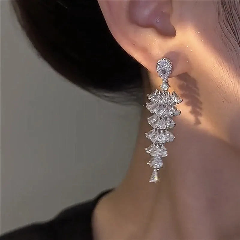 Silver pagoda coloured copper Christmas tree drop earrings with sparkling zircon details and stud fastening.