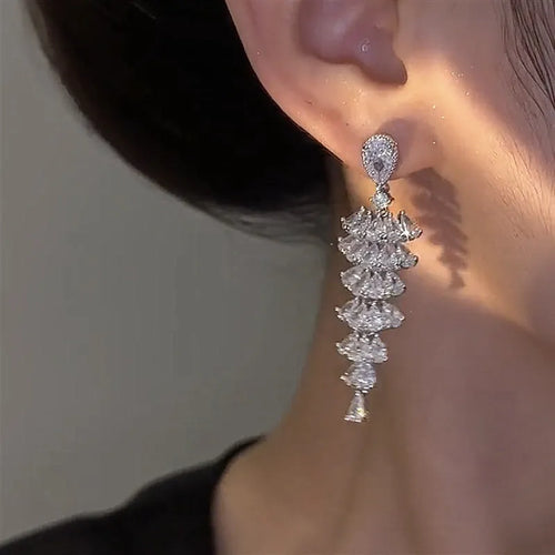 Silver pagoda coloured copper Christmas tree drop earrings with sparkling zircon details and stud fastening.