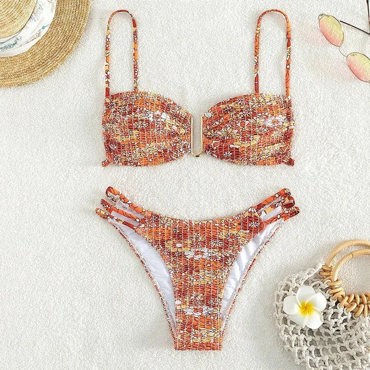 Women's orange high-waisted floral bikini swimsuit with matching bra
