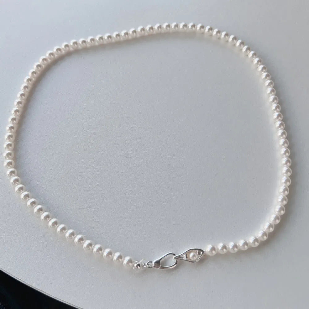 Women's sterling silver necklace with a pearl pendant on silver chain