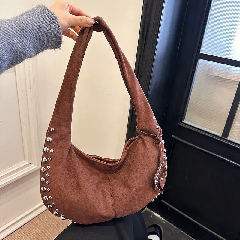 Strapless soft plush underarm tote handbag in a retro style, shown in one of its colour options.