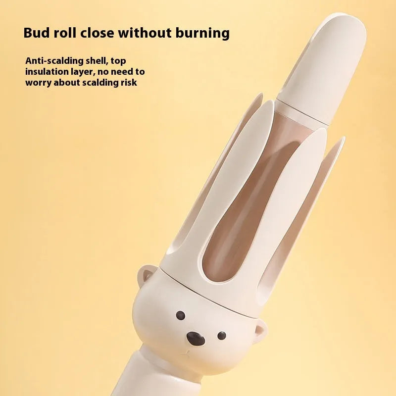 Beige anion automatic hair curler with wired power cord and included hair stick on a white background.