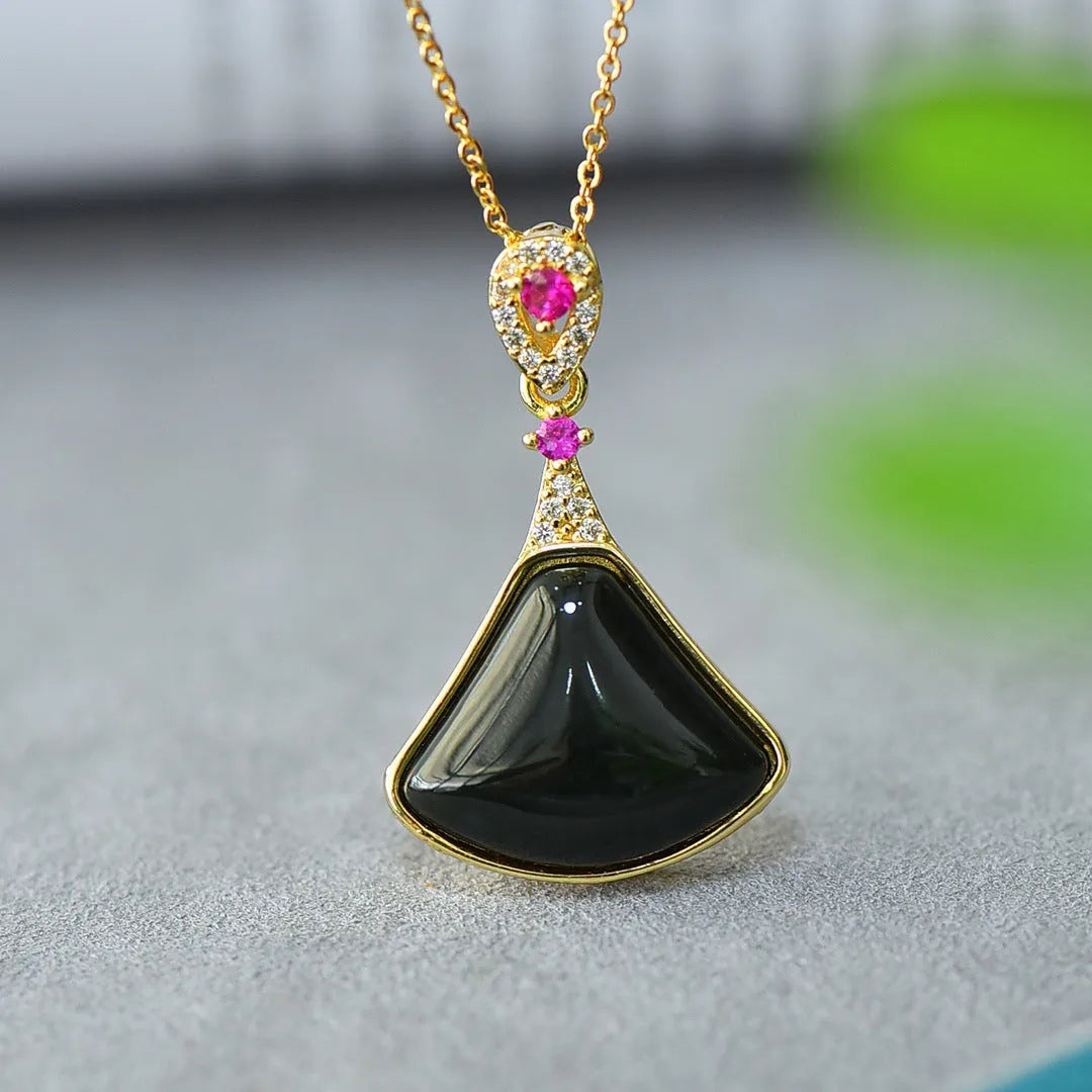 Copper inlaid natural Hetian gray and ink blue jade pendant necklace on a chain.