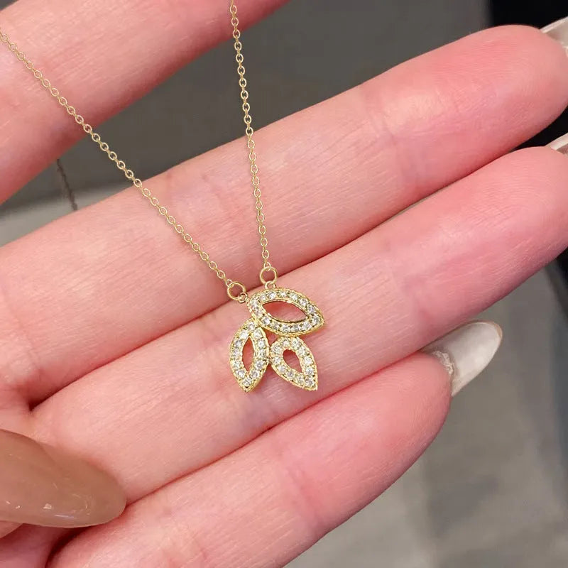 Women's yellow gold hollow leaf necklace with inlaid zircon and adjustable O-ring copper chain