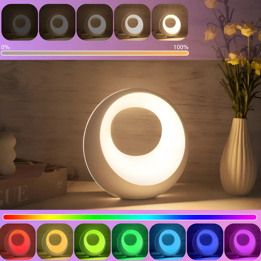 Creative Touch small white RGB colour changing night lamp with remote control on a wooden desk.
