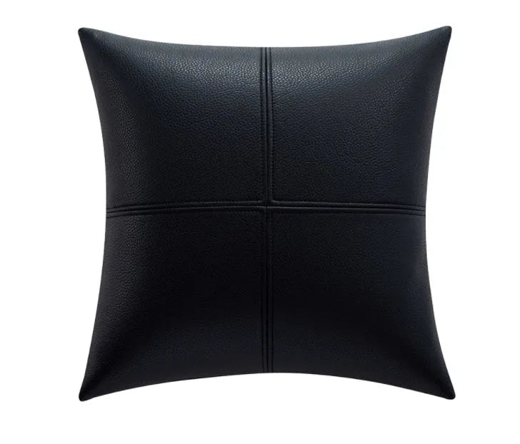 Soft cowhide leather pillow cover in a solid colour on a sofa.