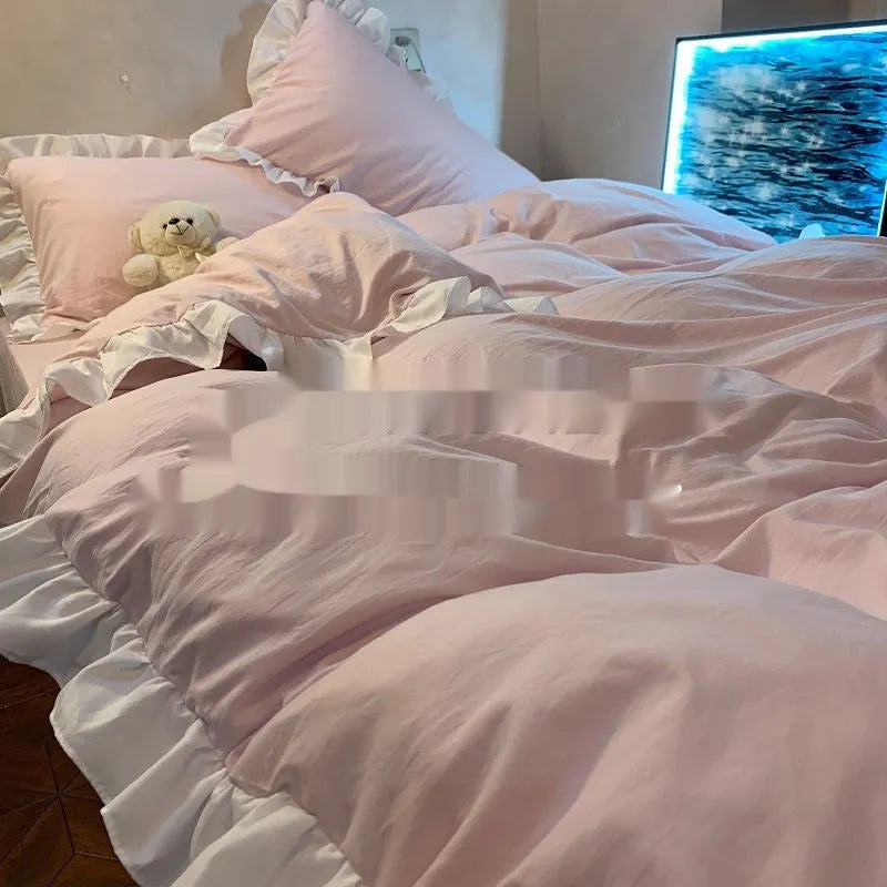 Solid colour washed linen quilt cover and pillowcases from a mori style four-piece bedding set.