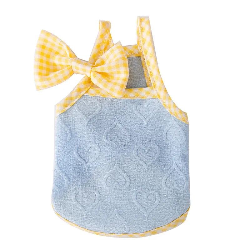 Small dog wearing heart relief texture bow suspenders vest in Bondi Blue colour with matching hairband