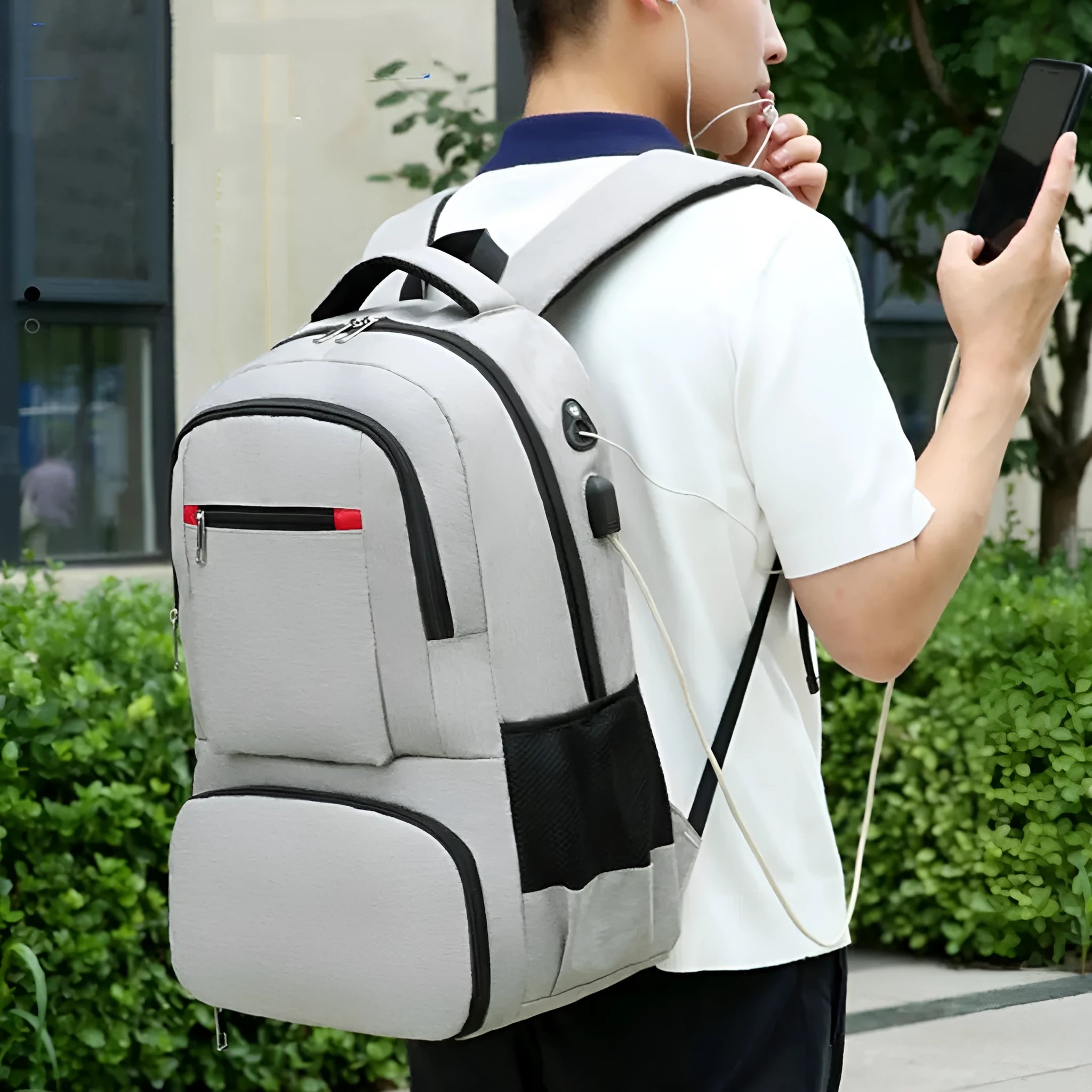 Oxford cloth insulated picnic backpack with curved straps, shown in light grey colour with pull rod belt attached.