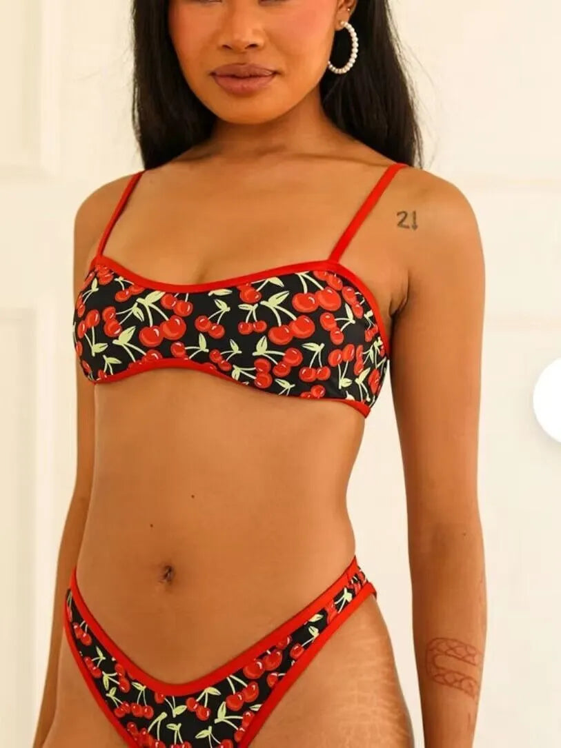 Women's cherry print floral polyester bikini swimsuit set with tube top and briefs.