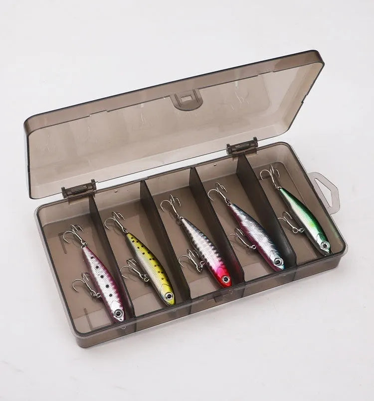 Set of five small silver fish lure pencil baits with double hooks and a tackle box