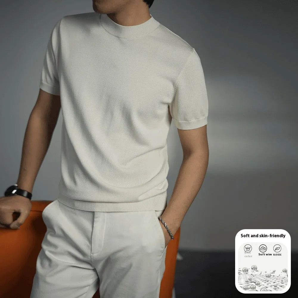 Men's solid colour knitted t-shirt with round neck and short sleeves in a polyester blend fabric.