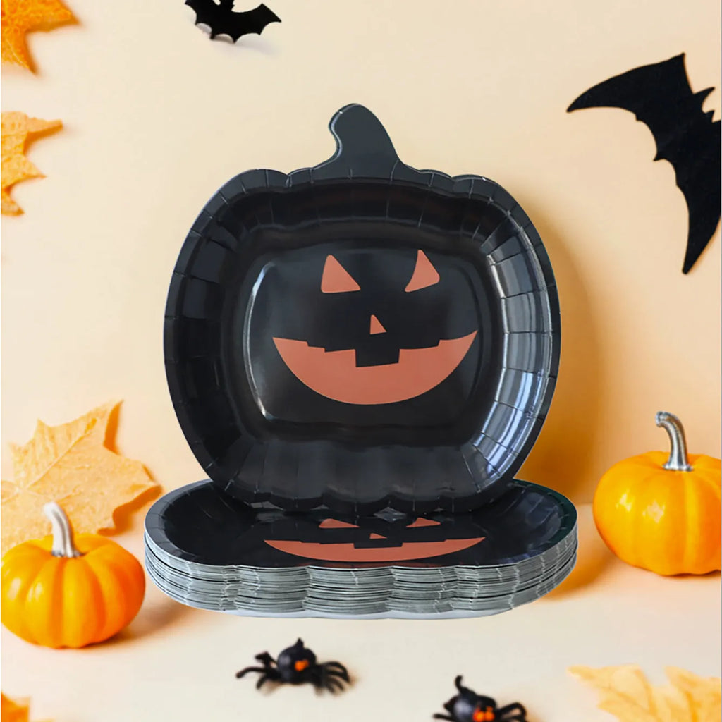 Black disposable paper plate with cute pumpkin design for Halloween, 9 inches in diameter.