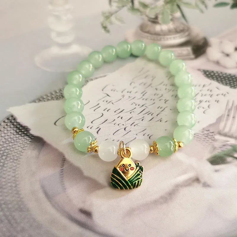 Chinese style glass bracelet with bamboo joint details in a red Lvzhu Duobao design.