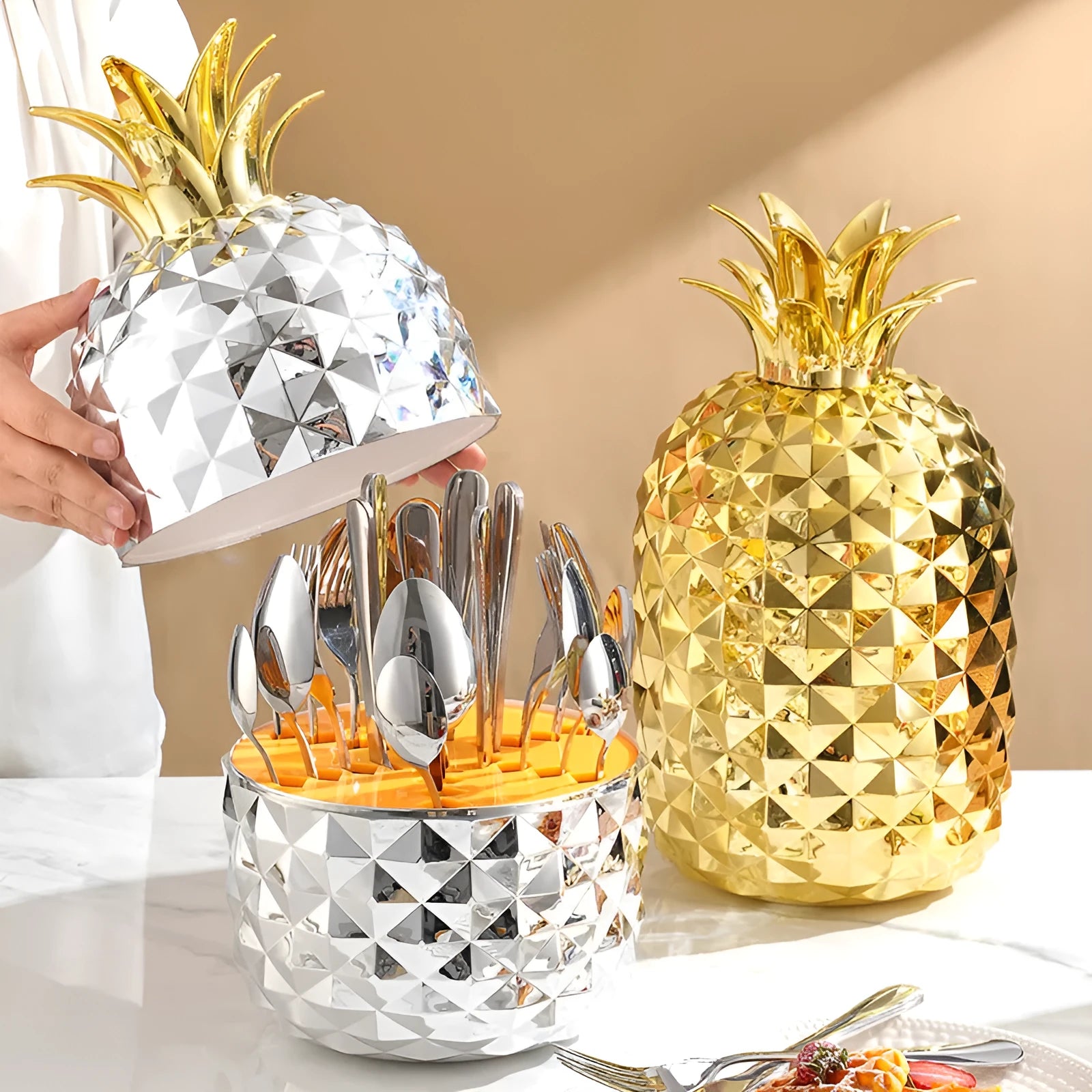 Fashion stainless steel 24-piece tableware set with mirror polish and pineapple egg design in gold finish on a dining table