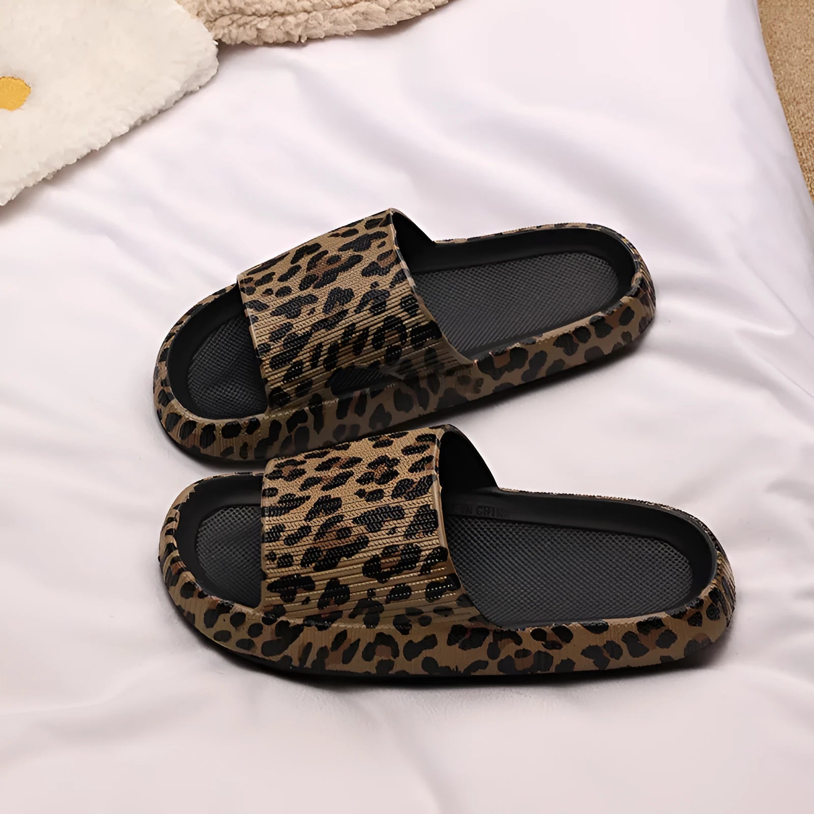 Women's leopard print EVA slippers with thick sole on a white background.